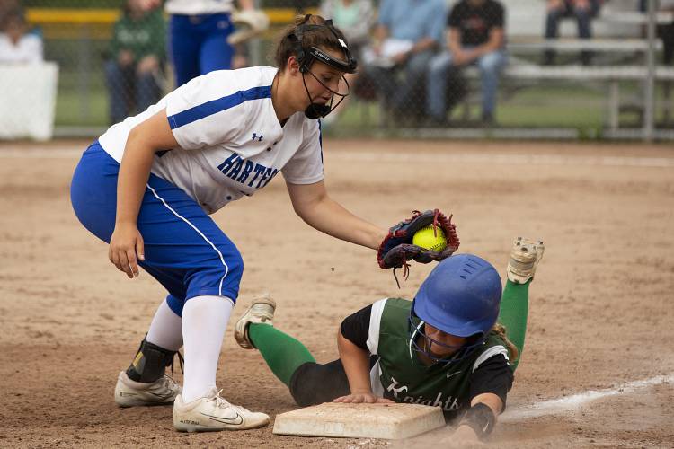Hartford’s Serenitee Martel (15) attempts to tag out Rice’s Alayna Havreluk (13) as she slides back to third base during a VPA Division II softball quarterfinal game at Maxfield Sports Complex in White River Junction, Vt., on Monday, June 5, 2023. Hartford won, 22-7. (Valley News / Report For America - Alex Driehaus) Copyright Valley News. May not be reprinted or used online without permission. Send requests to permission@vnews.com.