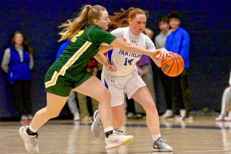 Thetford Academy's Rebecca Osgood, right, fends off Windsor's Brianna Barton during the Vermont Division III teams' Dec. 21, 2023, clash in Thetford, Vt. Windsor won, 41-31. (Valley News - Tris Wykes) Copyright Valley News. May not be reprinted or used online without permission. Send requests to permission@vnews.com. 