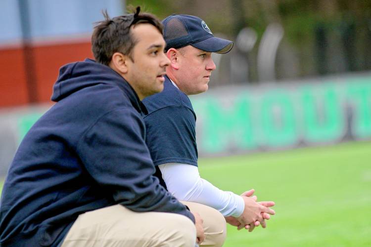 First-year Dartmouth College men's lacrosse head coach Sean Kirwan, right, watches his team alongside assistant Mikey Herring, during their Ivy League team's April 13, 2024, game against Yale on Scully-Fahey Field in Hanover, N.H. Yale won, 20-13. (Valley News - Tris Wykes) Copyright Valley News. May not be reprinted or used online without permission.