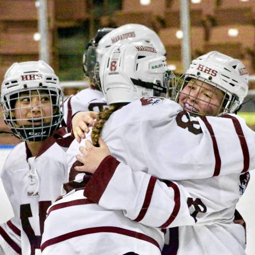 Hanover High's Casey Wilkinson, right, hugs Heidi Kauffman (8) after the Bears won the NHIAA Division I girls hockey championship on March 9, 2024, at SNHU Arena in Manchester, N.H. (Valley News - Tris Wykes) Copyright Valley News. May not be reprinted or used online without permission. 