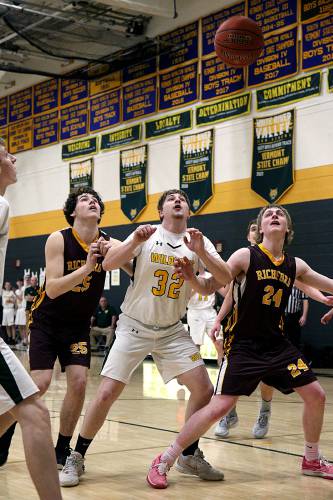 White River Valley’s Braden White (32) prepares to grab a rebound between Richford’s Robert Gendron (25) and Will Steinhour during their VPA D-III quarterfinal in South Royalton, Vt., on Feb. 24, 2024. The Wildcats won, 84-49. (Valley News - Geoff Hansen) Copyright Valley News. May not be reprinted or used online without permission. Send requests to permission@vnews.com.