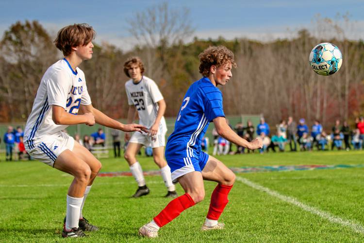 Hartford High's Bryce Soboleski, right, and Milton's Brock Bushey, left, watch the ball along with Luke Bushey (23) during the Vermont Division II teams' Oct. 25, 2023, first-round playoff game in White River Junction. Milton won, 2-1, in double overtime. (Valley News - Tris Wykes) Copyright Valley News. May not be reprinted or used online without permission. Send requests to permission@vnews.com.