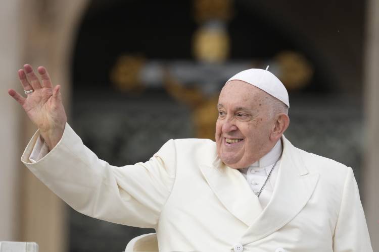 FILE - Pope Francis smiles as he waves faithful at the end of his weekly general audience in St. Peter's Square, at the Vatican, Wednesday, Nov. 22, 2023. Pope Francis cancelled his trip to Dubai for the U.N. climate conference on doctors’ orders. The announcement marked the second time the pope’s frail health had forced the cancellation of a foreign trip: He had to postpone a planned trip to Congo and South Sudan in 2022 because of knee inflammation, though he was able to make the...