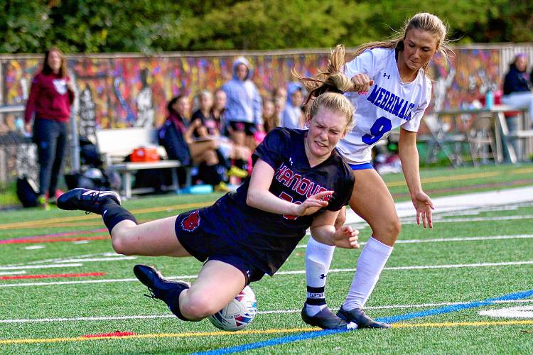 Hanover High's Sydney McLaughlin is taken down by Merrimack's Lexi Best, leading to the Bears converting a subsequent penalty kick during the NHIAA Division II teams' Sept. 26, 2023, game on Merriman-Branch Field in Hanover, N.H. Hanover won, 2-1. (Valley News - Tris Wykes) Copyright Valley News. May not be reprinted or used online without permission. Send requests to permission@vnews.com 
