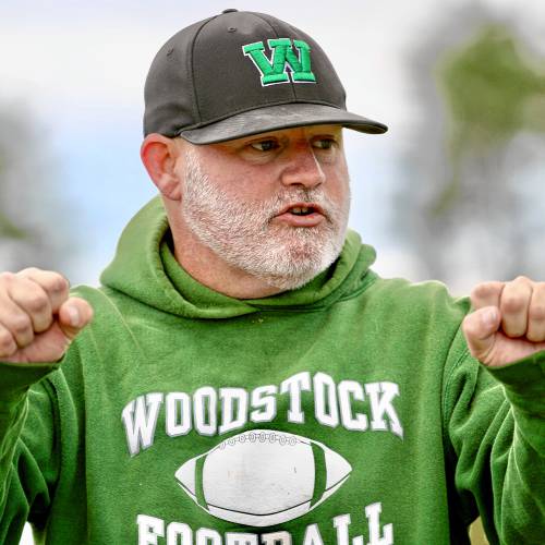 Woodstock High football coach Ramsey Worrell was inspired to outfit his players in protective Guardian Caps while watching a television broadcast showing his beloved University of Texas Longhorns wearing them. (Valley News - Tris Wykes) Copyright Valley News. May not be reprinted or used online without permission. Send requests to permission@vnews.com. 