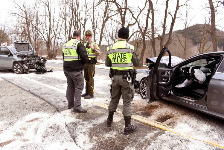 Vermont State Police Sgt. Sean Brennan and Trooper Ryan Butler take measurements at the scene of an crash along Route 5 in Fairlee, Vt., on Friday, March. 29, 2024. The vehicle matching the description of the car on the right was involved in a road rage incident earlier in Thetford. Local law enforcement had issued an alert for the car and the driver was taken into custody at the scene. The second car's driver was transported to the hospital.  (Valley News - Jennifer Hauck) Copyright Valley News. May not be reprinted or used online without permission. Send requests to permission@vnews.com.
