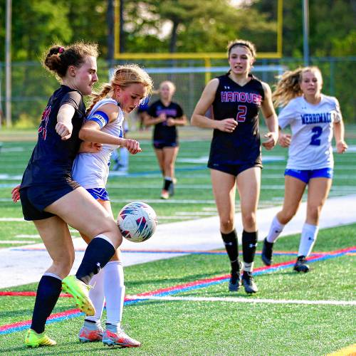 Hanover High's Elena Mierke, left, presses Merrimack's Alex Therman during the NHIAA Division II teams' Sept. 26, 2023, game on Merriman-Branch Field in Hanover, N.H. Hanover's Reese Hamlin is at near right and Merrimack's Hayley Fayreau is at far right. Hanover won, 2-1. (Valley News - Tris Wykes) Copyright Valley News. May not be reprinted or used online without permission. Send requests to permission@vnews.com 