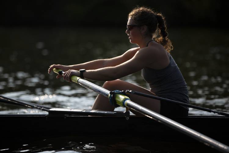 Anna Numme, 18, of Plainfield, N.H., rows down the Connecticut River with her team during crew practice with the Upper Valley Rowing Foundation in Hanover, N.H., on Thursday, May 18, 2023. Numme received a rowing scholarship to the University of Rhode Island where she will start in the fall. (Valley News / Report For America - Alex Driehaus) Copyright Valley News. May not be reprinted or used online without permission. Send requests to permission@vnews.com.