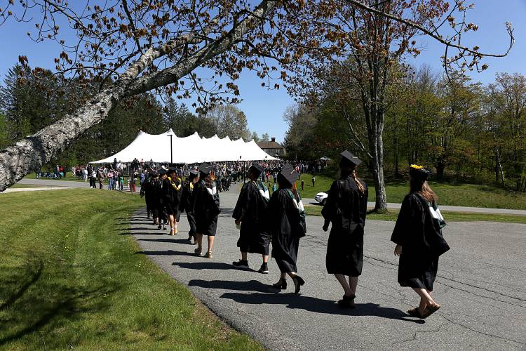 Vermont Technical College graduates walk to the big tent for their commencement ceremony in Randolph Center, Vt., on May 14, 2023. In July, VTC will become part of Vermont State University, a merging with Castleton University and Northern Vermont University. (Valley News - Geoff Hansen) Copyright Valley News. May not be reprinted or used online without permission. Send requests to permission@vnews.com.