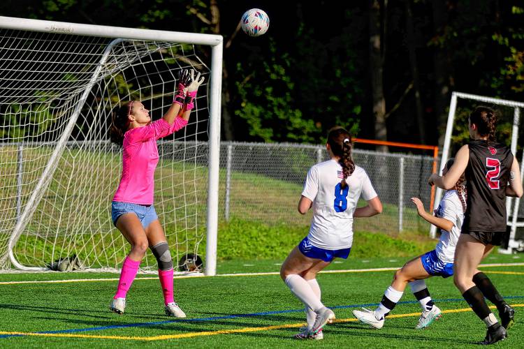 Hanover High goalkeeper Sadie Ross reaches to catch a shot against Merrimack during the NHIAA Division II teams' Sept. 26, 2023, game on Merriman-Branch Field in Hanover, N.H. Hanover won, 2-0. (Valley News - Tris Wykes) Copyright Valley News. May not be reprinted or used online without permission. Send requests to permission@vnews.com 