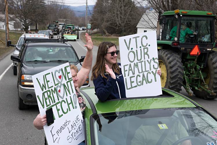Merry Emmons Lague, of Derby, left, and her daughter Keirstan Lague, show their support for Vermont Technical College during a parade around campus and through Randolph Center, Vt., Friday, April 24, 2020, a week after Vermont State Colleges Chancellor Jeb Spaulding announced a plan to close the college’s main campus in the center of the state. Vehicles in the parade stretched for about a mile-and-a-half as Orange County Sheriffs department directed traffic. Spaulding withdrew the proposal on Wednesday. (Valley News - James M. Patterson) Copyright Valley News. May not be reprinted or used online without permission. Send requests to permission@vnews.com.