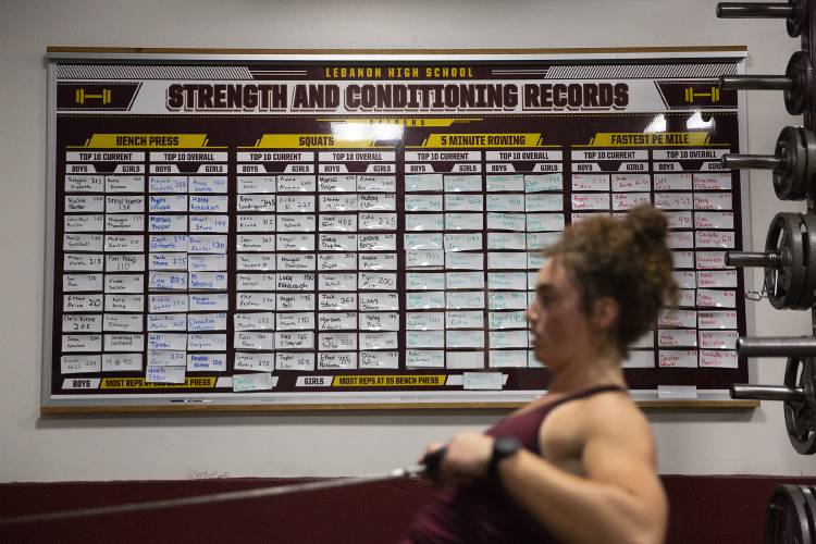Lebanon High School senior Anna Numme, 18, of Plainfield, N.H., works out after class in the school’s weight room in Lebanon, N.H., on Tuesday, May 16, 2023. Numme holds the girls’ top spot, both current and overall, for bench pressing 160 lbs. and squatting 260 lbs. (Valley News / Report For America - Alex Driehaus) Copyright Valley News. May not be reprinted or used online without permission. Send requests to permission@vnews.com.