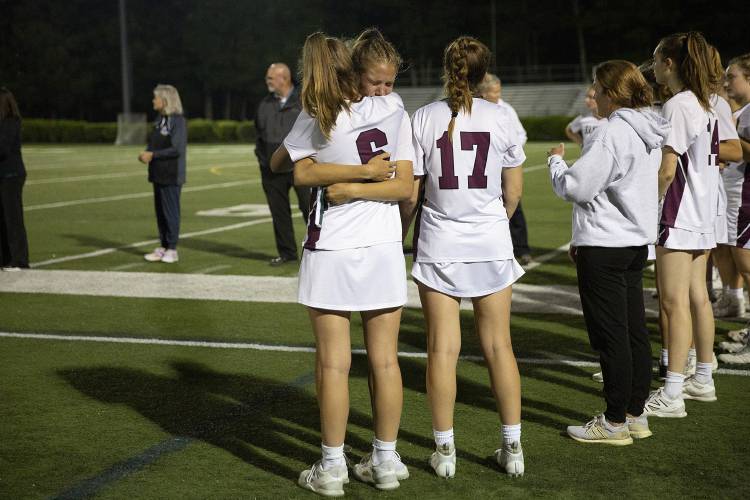 Hanover’s Maggie Higgins (4) cries as she hugs Kali McDonnell (6) after losing the NHIAA Division II girls lacrosse championship game against Hollis-Brookline High School at Stellos Stadium in Nashua, N.H., on Tuesday, June 6, 2023. Hollis-Brookline won, 12-11. (Valley News / Report For America - Alex Driehaus) Copyright Valley News. May not be reprinted or used online without permission. Send requests to permission@vnews.com.
