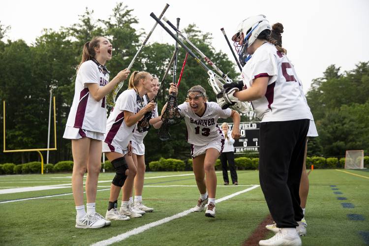 Hanover’s Reilly Loughman (13) runs through a tunnel of her teammates before the start of the NHIAA Division II girls lacrosse championship game against Hollis-Brookline High School at Stellos Stadium in Nashua, N.H., on Tuesday, June 6, 2023. Hollis-Brookline won, 12-11. (Valley News / Report For America - Alex Driehaus) Copyright Valley News. May not be reprinted or used online without permission. Send requests to permission@vnews.com.