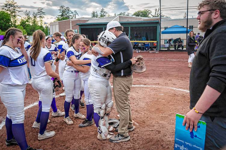 Oxbow coach Chuck Simmons hugs his daughter Makenna after the Olympians defeated Thetford during the Vermont Division III state championship in Castleton, Vt., on Saturday, June 10, 2023. (Glenn Russell photograph)