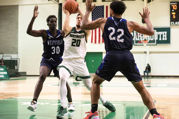 Romeo Myrthil, middle, of Dartmouth, is covered on his way to the basket by Juju Omot, left, and Brendon Hamilton, right, of Westfield State, at Leede Arena in Hanover, N.H., on Wednesday, Nov. 16, 2023. Myrthil emerged from the play with a cut above his eye. (Valley News - James M. Patterson) Copyright Valley News. May not be reprinted or used online without permission. Send requests to permission@vnews.com.