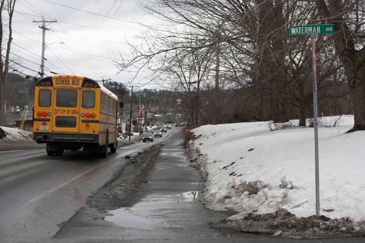 A Lebanon School District bus drives south on Route 12A near Waterman Avenue during afternoon drop-off in West Lebanon, N.H., on Friday, Feb. 2, 2024. A middle school student is in stable condition after being hit by a car while crossing the road to catch the bus Friday morning. (Valley News / Report For America - Alex Driehaus) Copyright Valley News. May not be reprinted or used online without permission. Send requests to permission@vnews.com.