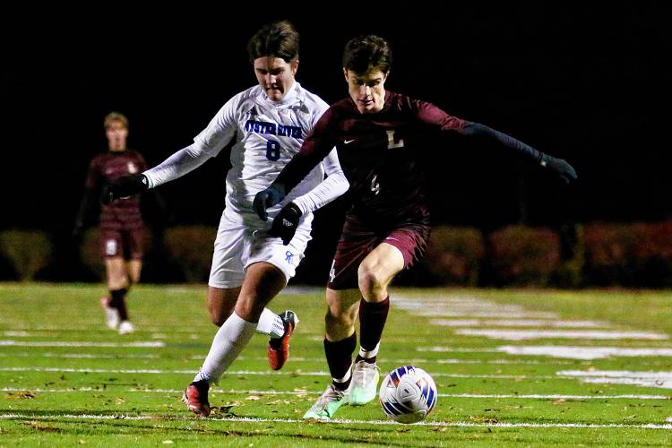 Lebanon High's Nick Brill (4) holds off Oyster River's Camden Tucker during the NHIAA Division II teams' playoff semifinal on Oct. 31, 2023, at Stellos Stadium in Nashua, N.H. Lebanon won, 1-0. (Valley News - Tris Wykes) Copyright Valley News. May not be reprinted or used online without permission. Send requests to permission@vnews.com