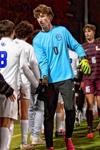 Lebanon High goalkeeper Zach Aldrich leads the handshake line following his team's 1-0 defeat of Oyster River during an Oct. 31, 2023, NHIAA Division II playoff semifinal at Stellos Stadium in Nashua, N.H. (Valley News - Tris Wykes) Copyright Valley News. May not be reprinted or used online without permission. Send requests to permission@vnews.com