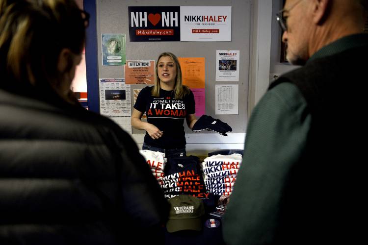 Nikki Haley volunteer Mia Raiti sells t-shirts during a campaign stop for Haley at the Newport Recreation Department on Wednesday, Dec. 13, 2023, in Newport, N.H. (Valley News - Jennifer Hauck) Copyright Valley News. May not be reprinted or used online without permission. Send requests to permission@vnews.com.