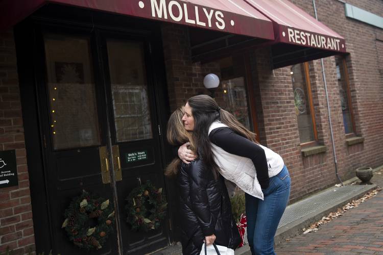 Molly’s owner Jennifer Packard, right, hugs former owner Patty Milowsky outside Molly's Restaurant & Bar in Hanover, N.H., on Wednesday, Jan. 3, 2024. Packard worked for Milowsky and her husband for over two decades and said they still have a close relationship, with Milowsky often stopping by the restaurant to say hello. (Valley News / Report For America - Alex Driehaus) Copyright Valley News. May not be reprinted or used online without permission. Send requests to permission@vnews.com.