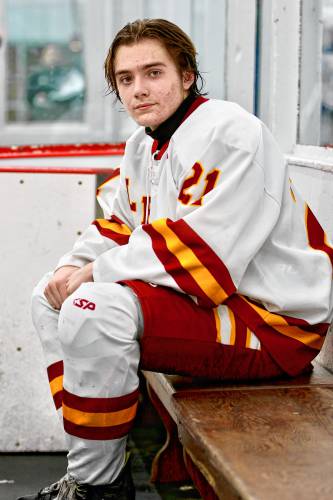 Mason Ballard, a Mascoma High student who plays on the Lebanon-Stevens-Mascoma boys hockey co-op team, sits on a Campion Rink bench for a photo on Jan. 27, 2024, in West Lebanon, N.H. (Valley News - Tris Wykes) Copyright Valley News. May not be reprinted or used online without permission.