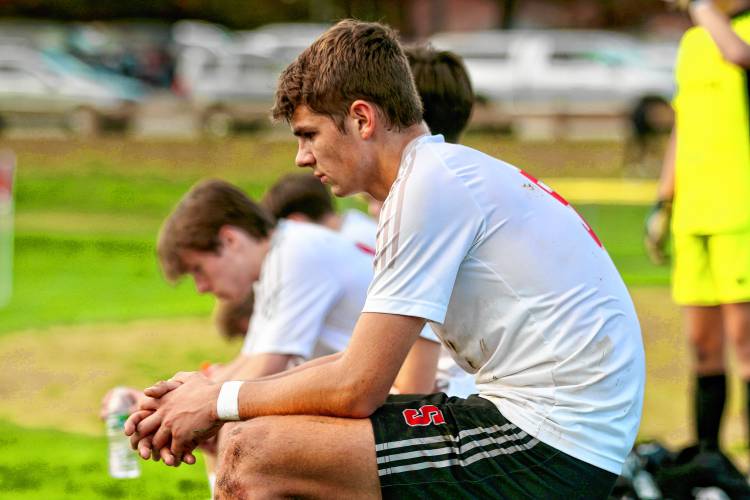 Stevens High soccer co-captain Luke Belisle rests on the bench at halftime of his team's 5-0 loss to Hopkinton during an NHIAA Division III first-found playoff game on Oct. 24, 2023, in Hopkinton, N.H. The Cardinals trailed, 2-0, at the break and lost their ninth consecutive game after beginning the season 7-0.  (Valley News - Tris Wykes) Copyright Valley News. May not be reprinted or used online without permission. Send requests to permission@vnews.com.