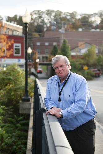 John Haverstock, of Quechee, photographed on Bridge Street in White River Junciton, Vt., on Wednesday, Oct. 25, 2023, began his work as Hartford’s new town manager on Oct. 2, after serving as town manager for 14 years in Pittsford, Vt. (Valley News - James M. Patterson) Copyright Valley News. May not be reprinted or used online without permission. Send requests to permission@vnews.com.