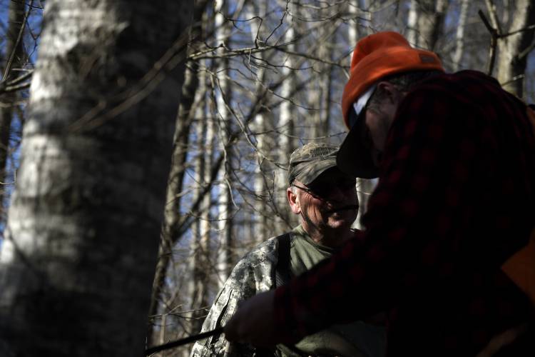 Deer hunter Ron Pierce, of Corinth, Vt., left, confers with licensed leashed dog tracker Riley Harness, of Newbury, Vt., when on a track with Harness' dog Daisy on Thursday, Nov. 16, 2023, in Corinth. Pierce had shot a buck the prior morning and had not been able to find it. (Valley News - Jennifer Hauck) Copyright Valley News. May not be reprinted or used online without permission. Send requests to permission@vnews.com.