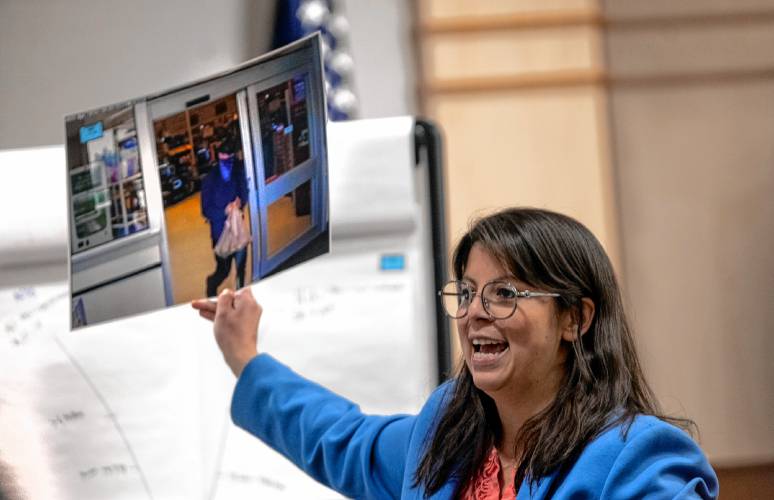 Defense attorney Maya Dominguez holds up a photograph of Logan Clegg leaving a store on the day of the shooting of Wendy and Steve Reid as she gives her closing to the jury on Thursday, October 19, 2023. Dominguez argued that Clegg had dark pants on, not tan khakis that witnesses said.
