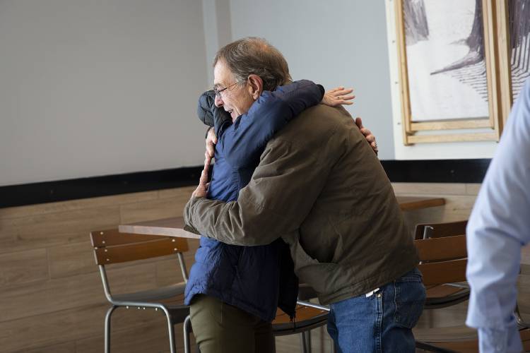 Richard West, right, of Rutland, Vt., hugs his daughter Narissa West-Brown, of Bedford, N.H., at Jersey Mike’s in West Lebanon, N.H., on Wednesday, Nov. 15, 2023. West’s eyes welled up with tears as he talked about the success and generosity of his daughter and her husband Chris Brown, who are the store’s franchisees. (Valley News / Report For America - Alex Driehaus) Copyright Valley News. May not be reprinted or used online without permission. Send requests to permission@vnews.com.