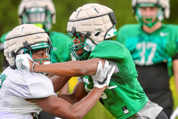 Dartmouth College defensive back Cameron Best-Alston, right, battles receiver Daniel Haughton during an Aug. 21, 2023, blocking drill on the Blackman Fields. (Valley News - Tris Wykes) Copyright Valley News. May not be reprinted or used online without permission. Send requests to permission@vnews.com.