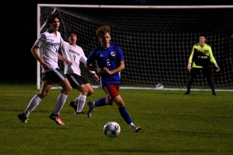 Hartford's Bryce Soboleski, and Woodstock's Oliver Boswell chase down the ball during their game on Wednesday, Oct. 11, 2023, in White River Junction, Vt. Hartford won, 3-1.    (Valley News - Jennifer Hauck) Copyright Valley News. May not be reprinted or used online without permission. Send requests to permission@vnews.com.