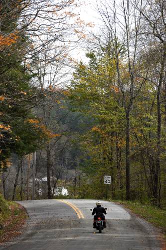A motorcyclist rides down Tunbridge Road in Strafford, Vt., on Wednesday, Oct. 19, 2023. (Valley News - Jennifer Hauck) Copyright Valley News. May not be reprinted or used online without permission. Send requests to permission@vnews.com.