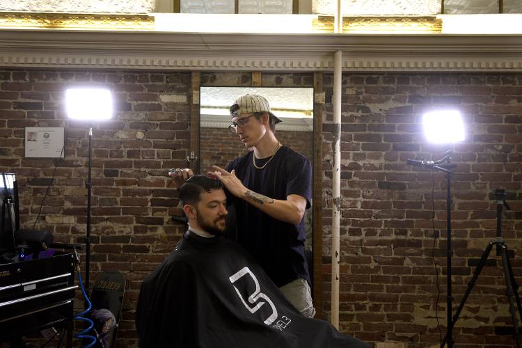 At Studio 41 in Claremont, N.H. Brandon George, 27, of Claremont gets his bi-monthly haircut by owner Chance Easter, 27, of Chester, Vt. on Wednesday, Nov. 8, 2023. Both were asked their opinion about Donald Trump who will be making a campaign stop on Saturday. (Valley News - Jennifer Hauck) Copyright Valley News. May not be reprinted or used online without permission. Send requests to permission@vnews.com.