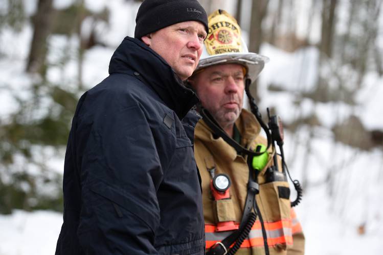 Adam Fanjoy, an investigator for the New Hampshire Fire Marshal's Office, and Sunapee Fire Chief John Galloway discuss a structure fire in Sunapee, N.H., on Friday, Jan. 19, 2024. The building containing 14 units was destroyed by fire on Thursday night. (Valley News - Jennifer Hauck) Copyright Valley News. May not be reprinted or used online without permission. Send requests to permission@vnews.com.
