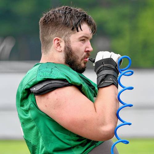 Dartmouth College defensive lineman Hank Knez takes a water break during an Aug. 21, 2023, practice on the Blackman Fields. (Valley News - Tris Wykes) Copyright Valley News. May not be reprinted or used online without permission. Send requests to permission@vnews.com.