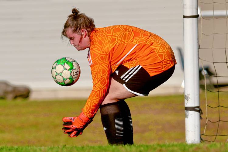 Sharon Academy goalkeeper Abby Chase makes a save during her team's 7-3 loss to Vermont Division IV foe Poultney on Oct. 3, 2023, game in Sharon, Vt.  (Valley News - Tris Wykes) Copyright Valley News. May not be reprinted or used online without permission. Send requests to permission@vnews.com.
