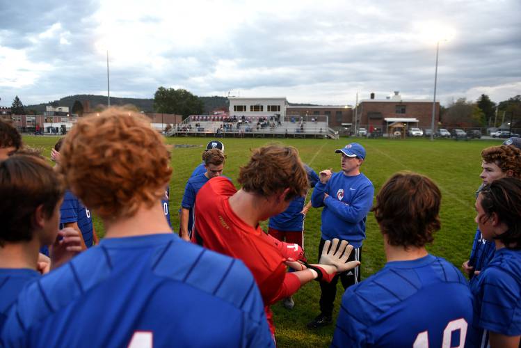 Hartford head coach Connor Brooks talks with his boys soccer team before the start of their game with Woodstock on Wednesday, Oct. 11, 2023, in White River Junction, Vt. Hartford won, 3-1.  (Valley News - Jennifer Hauck) Copyright Valley News. May not be reprinted or used online without permission. Send requests to permission@vnews.com.