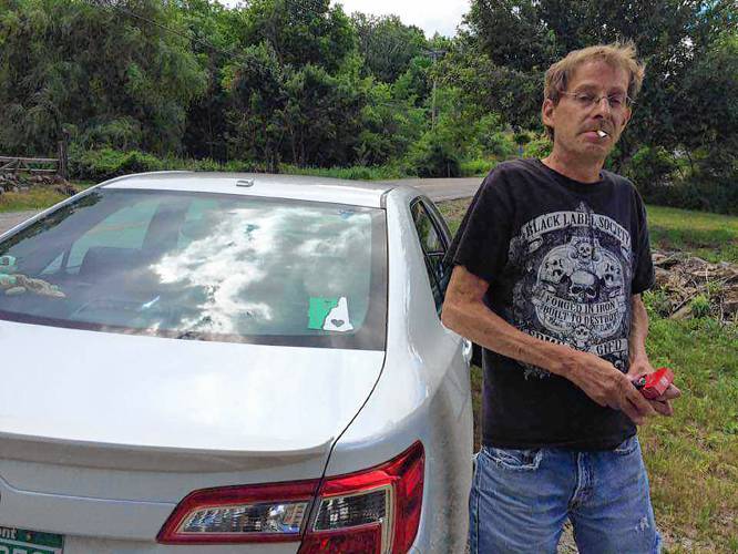 Chris Conant next to his sister Hilary Conant's car when they were cruising around roads in Sullivan County and listening to music in 2017. (Family photograph)