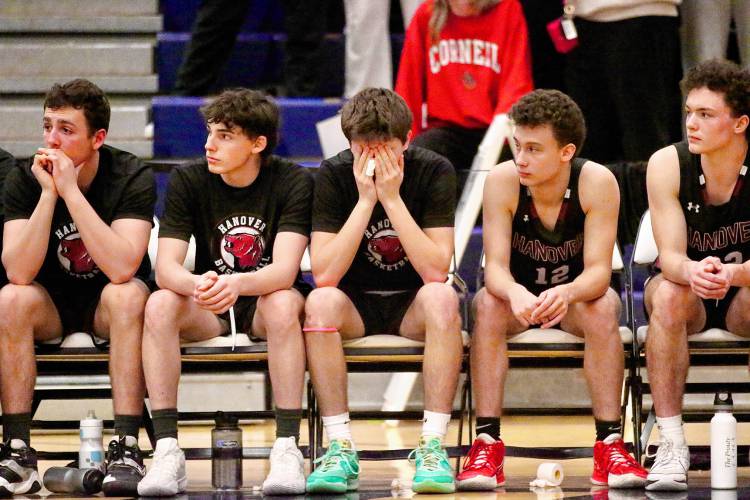 Hanover High basketball players, from left, Sam Bagatell, Jackson Lobb, Caleb Buskey, Freddie Mierke and Allie Muirhead watch the final minute of their 51-41 loss to Pelham in the NHIAA Division II title game on March 10, 2024, at the University of New Hampshire’s Lundholm Gym. (Valley News - Tris Wykes) Copyright Valley News. May not be reprinted or used online without permission.