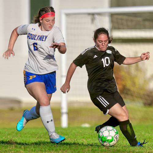 Sharon Academy's Aleyna Aydogan (10) attempts to dribble past Poultney's Courtney Ezzo during the Vermont Division IV teams' game on Oct. 3, 2023, in Sharon, Vt. Poultney won, 7-3. (Valley News - Tris Wykes) Copyright Valley News. May not be reprinted or used online without permission. Send requests to permission@vnews.com.