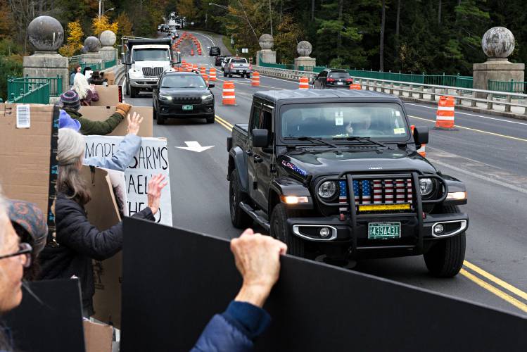 A driver gestures to demonstrators calling for an end to violence between Israel and Hamas on the Ledyard Bridge between Hanover, N.H., and Norwich, Vt., on Monday, Oct. 23, 2023. Participants held signs up to drivers leaving Hanover between 3:30 p.m. and 4:45 p.m., many condemning Israel's response to the attacks by Hamas on Oct. 7. (Valley News - James M. Patterson) Copyright Valley News. May not be reprinted or used online without permission. Send requests to permission@vnews.com.