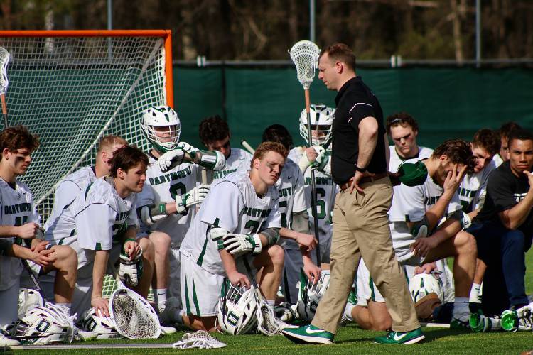 Dartmouth College men's lacrosse coach Brendan Callahan speaks to his team Saturday after it suffered its 27th consecutive Ivy League loss, 13-4 against Princeton. The Big Green visits league-leading Pennsylvania next weekend. (Valley News - Tris Wykes)