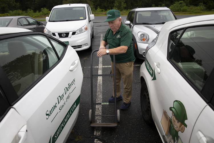 Norbert Jarvis, 74, of Weathersfield, Vt., loads a dolly into a company car at Vital Delivery Solutions in West Lebanon, N.H., on Friday, August 25, 2023. Jarvis has worked for the courier service for four years after working as an electrician for most of his life. (Valley News / Report For America - Alex Driehaus) Copyright Valley News. May not be reprinted or used online without permission. Send requests to permission@vnews.com.