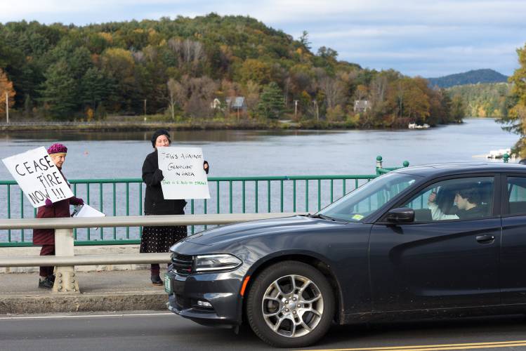 Liz Blum, of Norwich, left, and Daisy Goodman, of Lyme, right, of Jewish Voice for Peace, get a thumbs-up from a driver while calling for an end to violence in Gaza on the Ledyard Bridge in Hanover, N.H., on Monday, Oct. 23, 2023. Demonstraters lined the north side of the bridge from 3:30 p.m. to 4:45 p.m. (Valley News - James M. Patterson) Copyright Valley News. May not be reprinted or used online without permission. Send requests to permission@vnews.com.