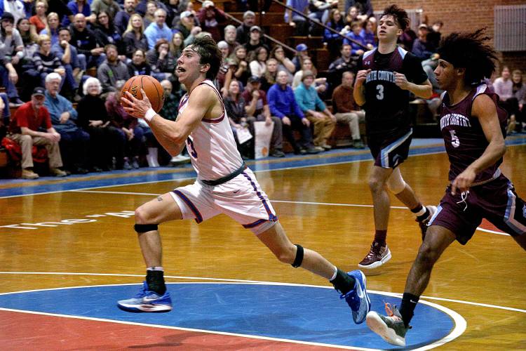 Hartford’s Christian Hathorn drives for a layup on a break away from North Country defenders Jason Pellitier (5) and Haidin Chilafoux during their VPA D-II semifinal in Barre, Vt., on Feb. 24, 2024. Hartford won, 66-48, advancing to Saturday’s title game. (Valley News - Geoff Hansen) Copyright Valley News. May not be reprinted or used online without permission. Send requests to permission@vnews.com.