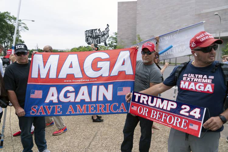 Supporters of former President Donald Trump rally outside the E. Barrett Prettyman U.S. Federal Courthouse, Thursday, Aug. 3, 2023, in Washington. Trump is due in federal court in Washington today, to answer charges he sought to overturn his 2020 presidential election loss. (AP Photo/Jose Luis Magana)