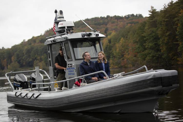 New Hampshire Attorney General John Formella, center, and Vermont Attorney General Charity Clark, right, take a ride on a New Hampshire State Police Marine Patrol boat operated by Sgt. Nicholas Haroutunian as they participate in the 12th perambulation of the states’ border on the Connecticut River in Hanover, N.H., on Friday, Oct. 6, 2023. State law requires the Attorneys General inspect the border every seven years following a U.S. Supreme Court decision that settled a 1917 dispute over New Hampshire’s attempt to tax a paper mill near Bellows Falls, Vt., that was located partially in the riverbed, determining that the boundary is the low-water mark on the Vermont side of the river. The actual surveying of the boundary is conducted by representatives of both states’ departments of transportation Formella explained, noting that he and Clark weren’t qualified for that job. “If we had done the work I wouldn’t really trust that it was accurate,” he joked. (Valley News / Report For America - Alex Driehaus) Copyright Valley News. May not be reprinted or used online without permission. Send requests to permission@vnews.com.