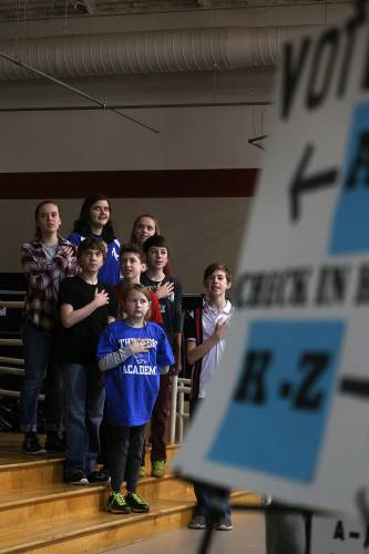 Thetford Academy seventh-graders lead Town Meeting attendees in the Pledge of Allegiance at the start of the annual meeting in Thetford, Vt., on Feb. 27, 2016. (Valley News - Geoff Hansen) Copyright © Valley News. May not be reprinted or used online without permission. Send requests to permission@vnews.com.